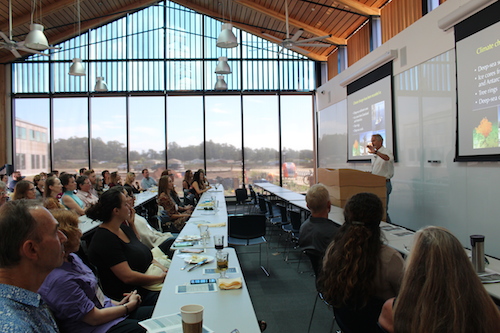 view of room full of attendees and presenter